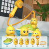 A set of cute yellow duck water spray bath toys for kids, including a main toy and several smaller versions.