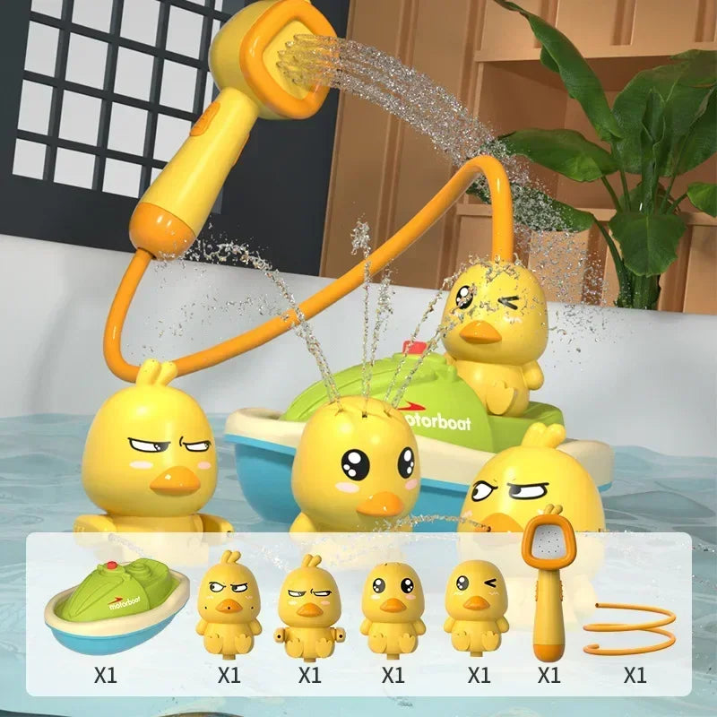 A set of cute yellow duck water spray bath toys for kids, including a main toy and several smaller versions.