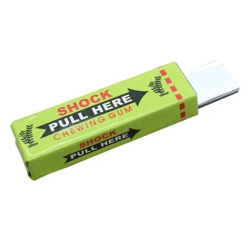 A lime green electric shock gum prank toy with a white plastic tip and text instructing to pull here.