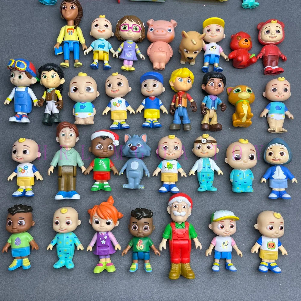 A collection of colorful PVC figurines featuring various cartoon characters and animals.