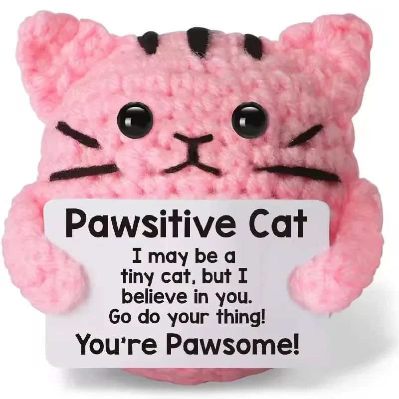 Pink fluffy cat crochet toy with black stripes and large eyes