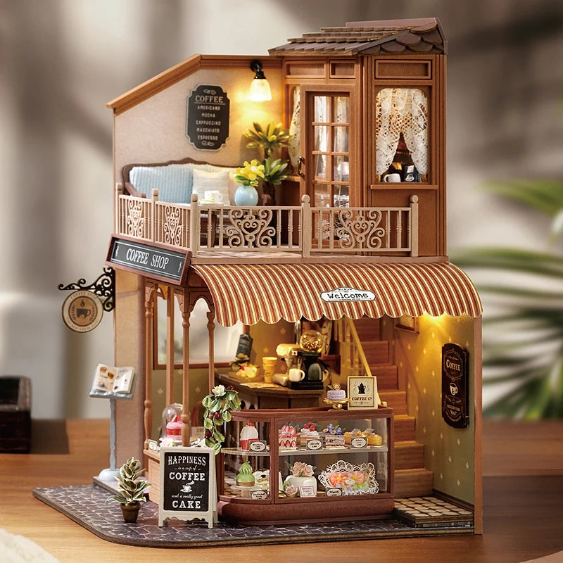 A detailed wooden miniature dollhouse kit featuring a coffee shop facade with LED lighting and various decorative elements.