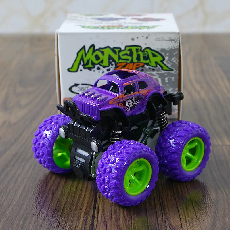 A purple monster truck toy with green wheels is displayed in front of its packaging box.