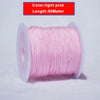 Pink nylon knotting cord on a spool with a label indicating the color is light pink and the length is 50 meters.
