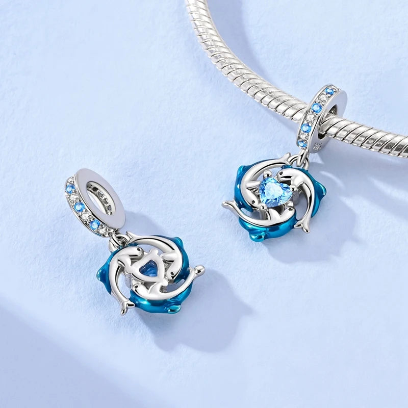 Sterling silver charm pendant set featuring starfish, sea turtle, and whale shark designs.