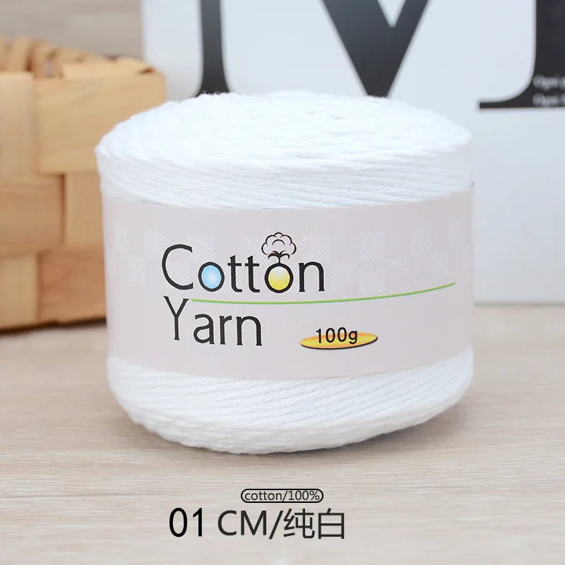 A white spool of 100% cotton yarn labeled as Cotton Yarn, measuring 01 CM.