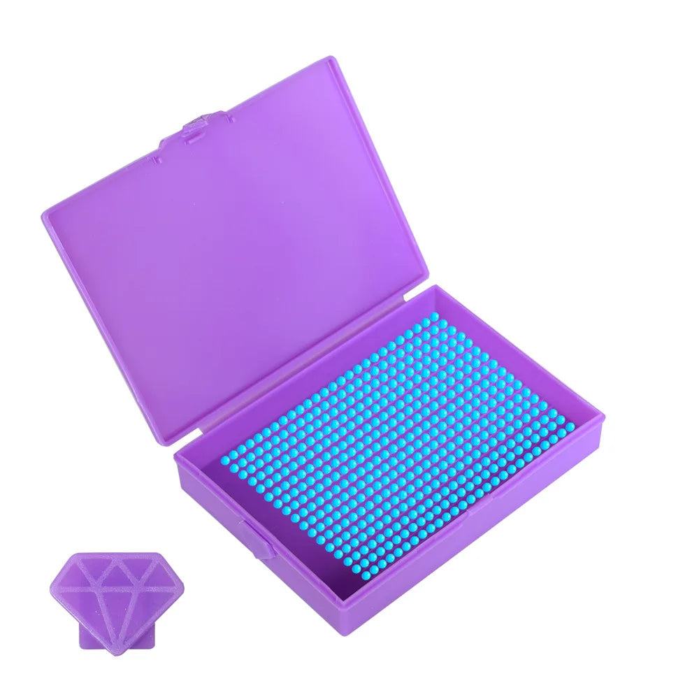 A purple diamond painting storage organizer box open to reveal a tray of blue beads and a diamond-shaped piece.