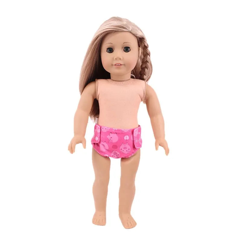 A soft doll wearing pink patterned underwear and long brown hair.