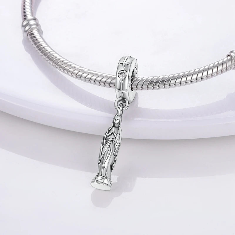 Sterling silver charm beads set featuring cross, angel, and evil eye designs for DIY jewelry making