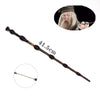 A long, elegant metal cosplay magic wand with a decorative handle and a head featuring an elderly man's face.