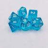 A collection of twelve translucent blue acrylic polyhedral dice scattered on a white surface.