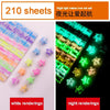 A set of 210 sheets of origami star strips in various colors, shown alongside night light renderings.