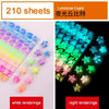 A collection of 210 sheets of luminous cupid star strips in various colors, shown alongside night renderings.