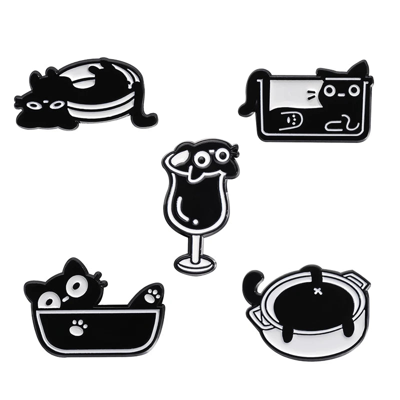 A set of four black cat enamel pins featuring various cat faces and silhouettes.