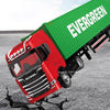 A red Scania locomotive/carriage model with green siding and the word EVERGREEN on it, shown in a close-up view.