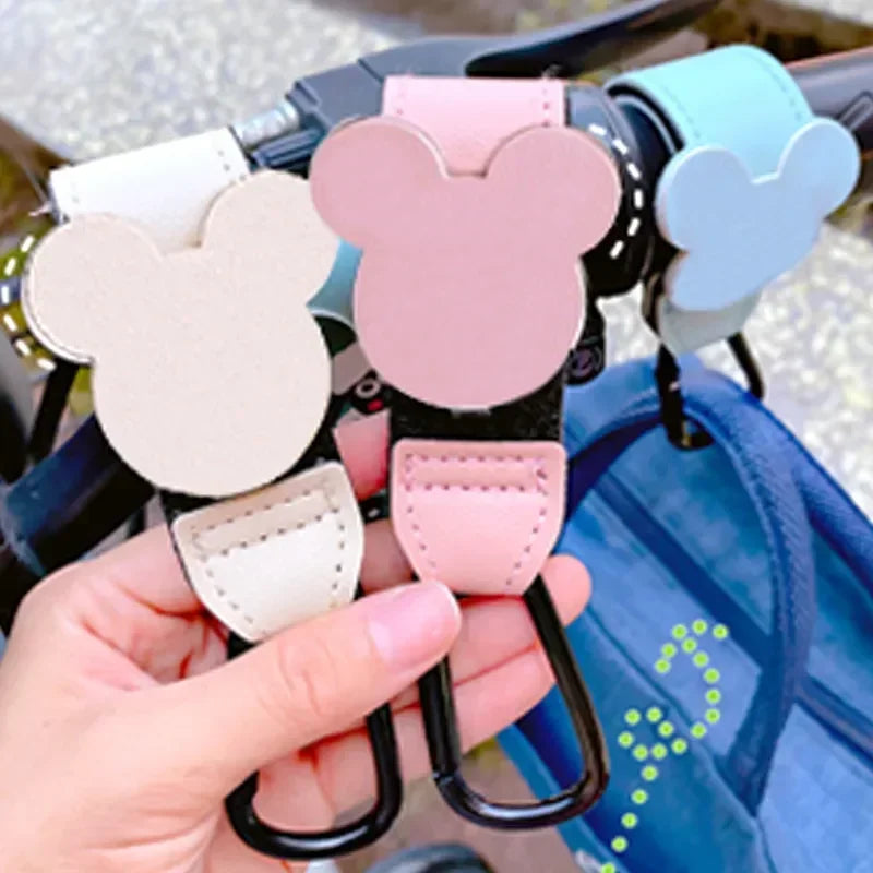Pink and light blue Mickey Mouse themed organizer hooks for stroller accessories