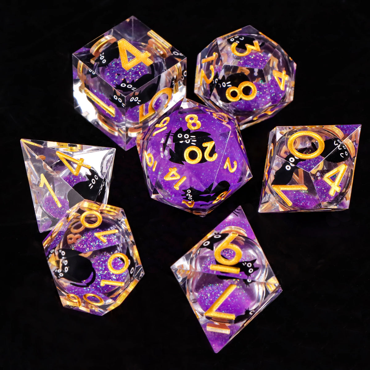 A collection of translucent purple and yellow liquid core dice, including d4s, d8s, d10s, d12s, and d20s.