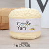 A ball of light yellow cotton yarn labeled Cotton Yarn 100g with a measurement of 16 CM.