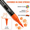 A black dual-tip glitter brush marker pen is shown with orange accents, demonstrating vibrant colors and smooth application.