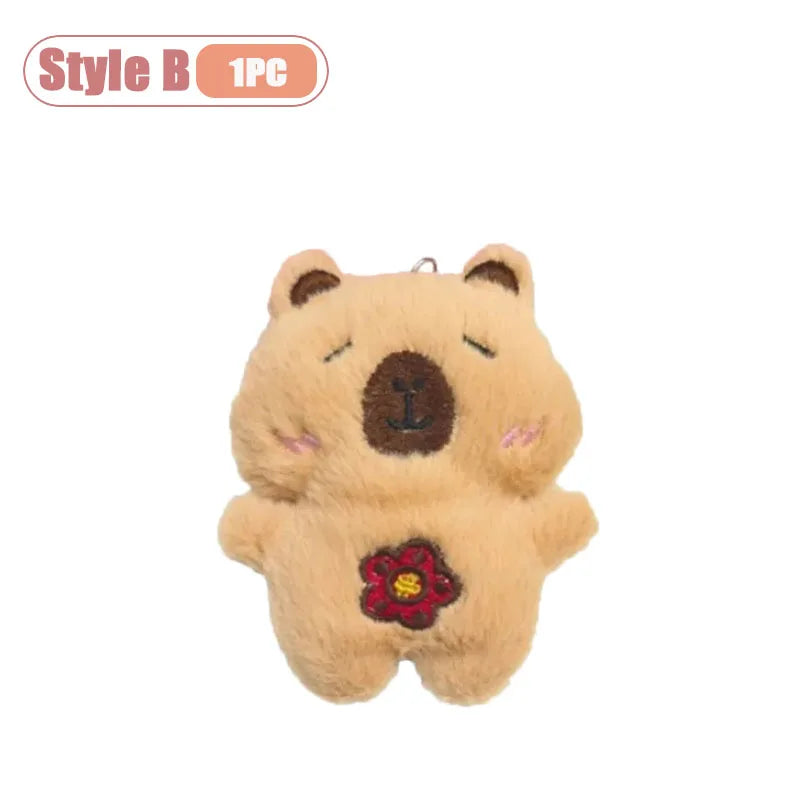 A light brown plush bear with a small red flower detail, packaged as a Style B 1PC item.
