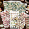 A collection of vintage label stickers and stamps for scrapbooking and journaling displayed on a wooden surface.