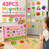A box of 43 pieces of magnetic fruits and vegetables learning toys next to a refrigerator door displaying various fruit and v
