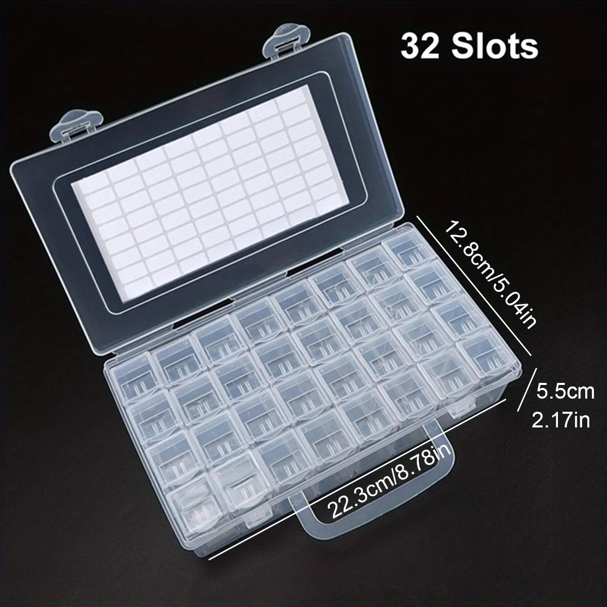 A clear plastic storage organizer with 32 slots is shown open, displaying numerous small compartments for craft supplies.