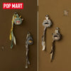 A collection of POP MART Hirono Mist-Walker series blind box keychains featuring fuzzy, creature-like figures.