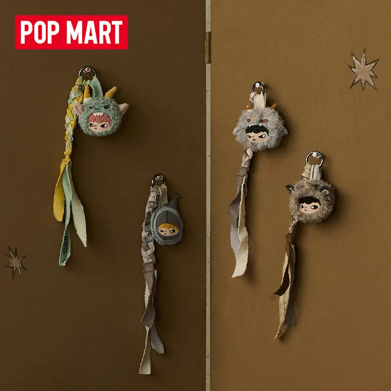 A collection of POP MART Hirono Mist-Walker series blind box keychains featuring fuzzy, creature-like figures.