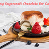 A strawberry silicone mold is shown next to a cake decorated with strawberry cream and chocolate for cake decor.