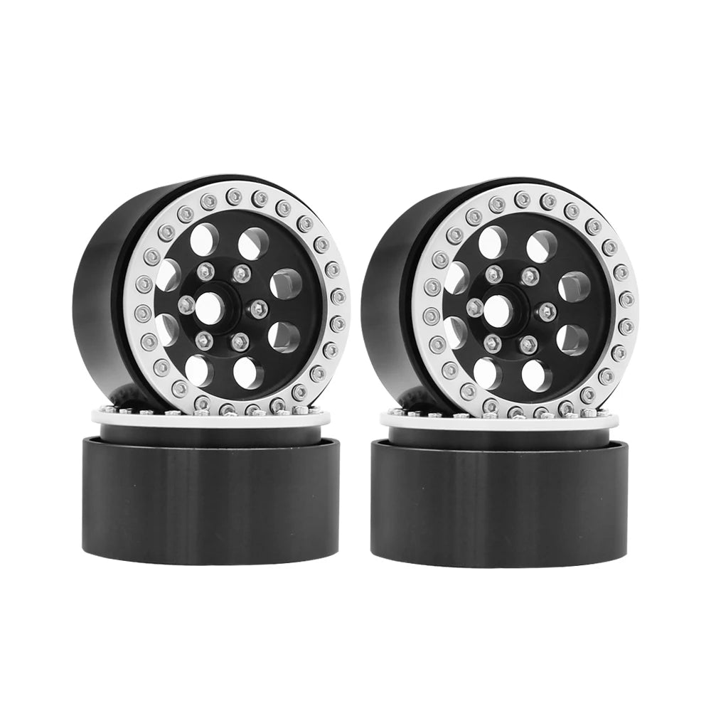 A pair of black metal beadlock wheels with a removable hex hub for an RC crawler.