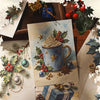 A collection of embossed Christmas decorative paper sheets featuring winter themes, including gifts, greenery, and festive el