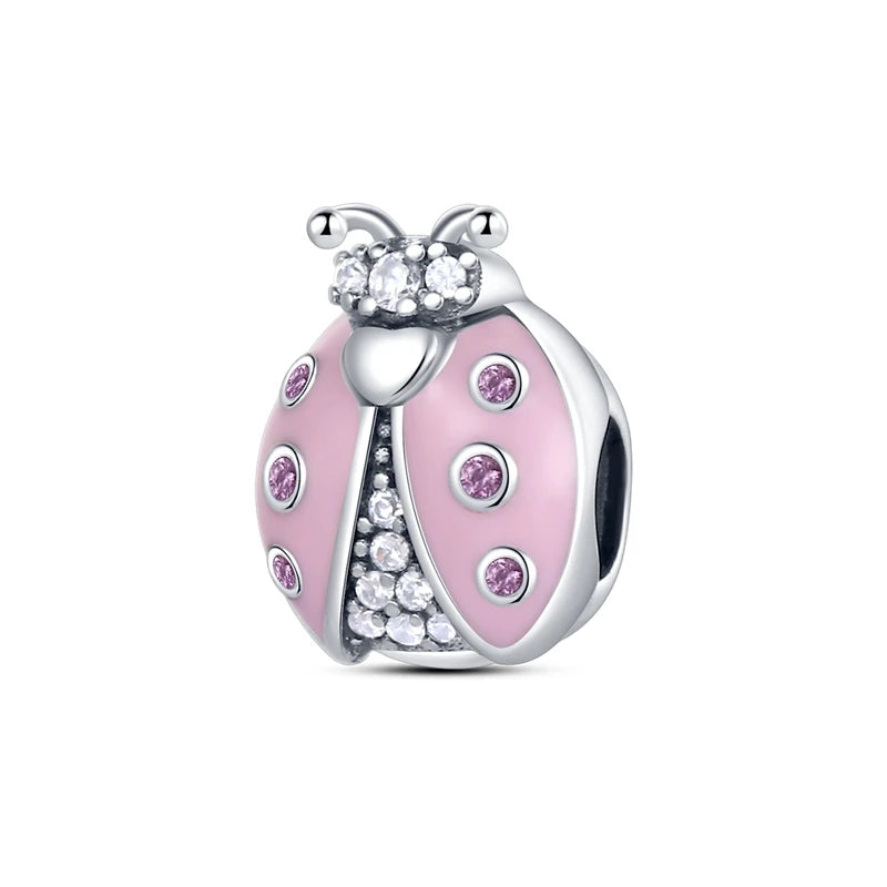A heart-shaped charm bead made of 925 sterling silver with pink zircon accents.
