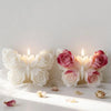 Two white and pink rose butterfly silicone molds for candles and DIY crafts