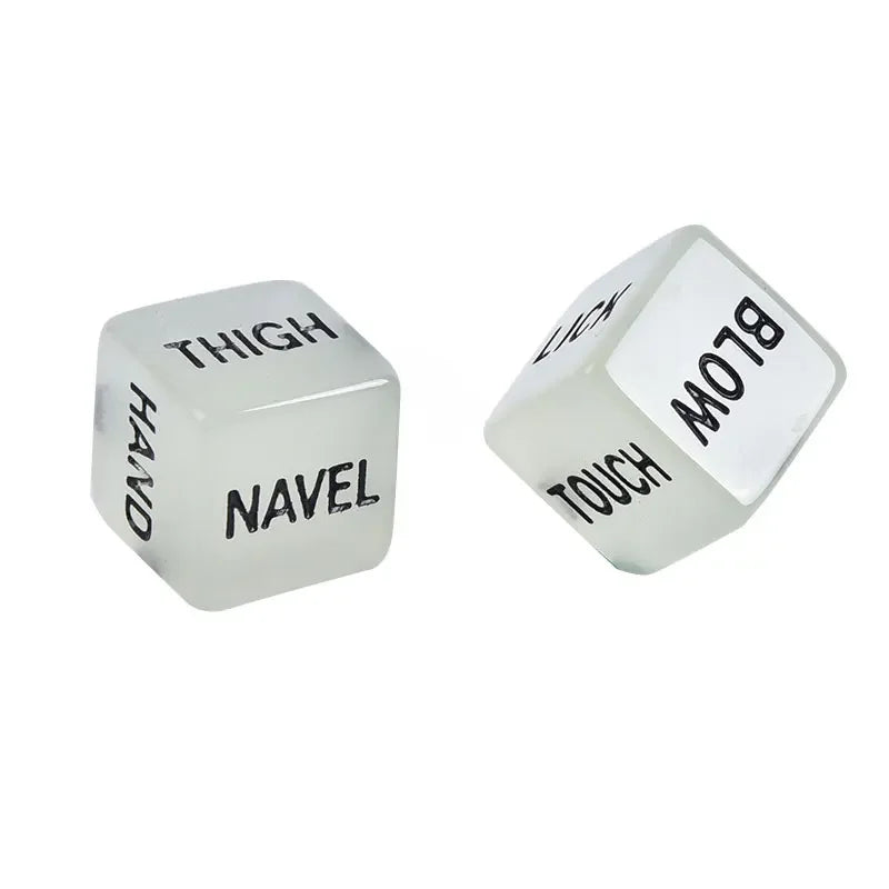 A set of glow-in-the-dark dice showing body parts like thigh, hand, navel, and blow.