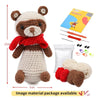 A handmade brown and white teddy bear crochet kit with yarn and tools for beginners