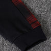 Black and red plaid fleece-lined hooded two-piece set shown on a gray textured fabric.