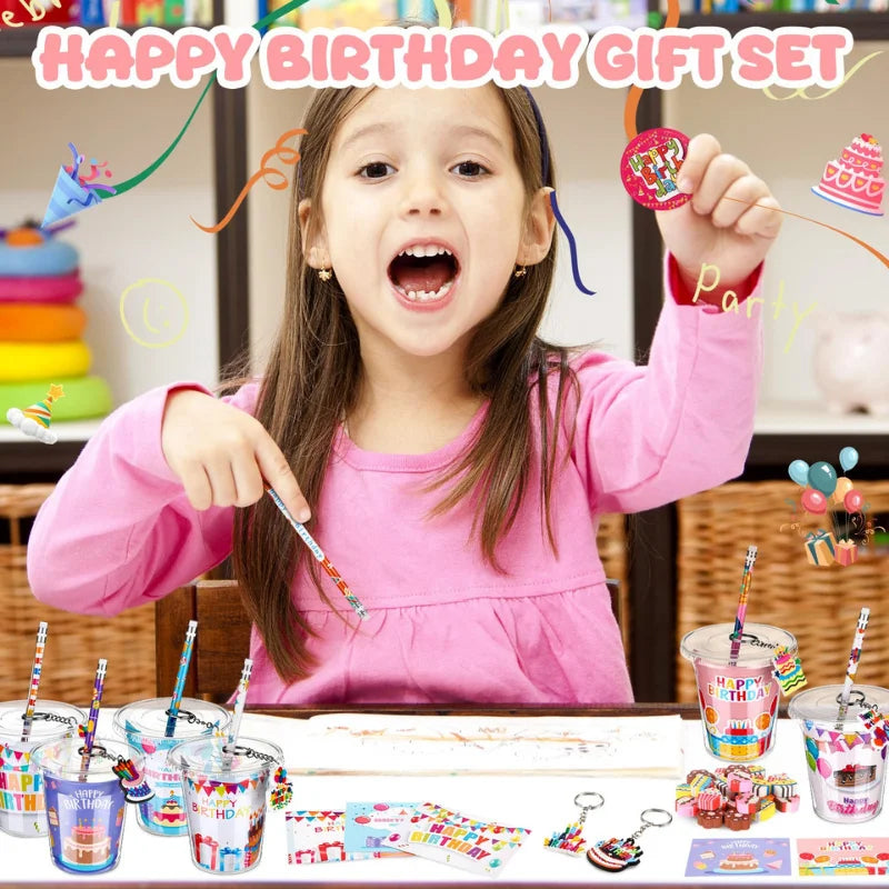 A smiling girl holds up a colorful birthday gift set including cups, stickers, and pencils for a party.