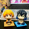 A figure set of Tanjiro and Nezuko from Demon Slayer, featuring detailed sculpted characters.