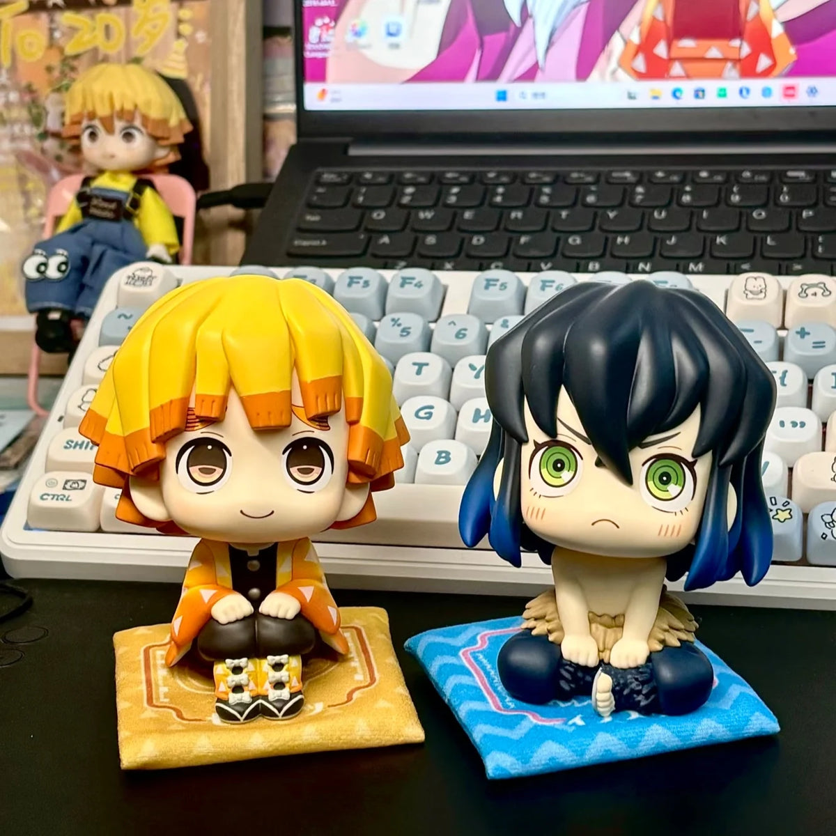 A figure set of Tanjiro and Nezuko from Demon Slayer, featuring detailed sculpted characters.