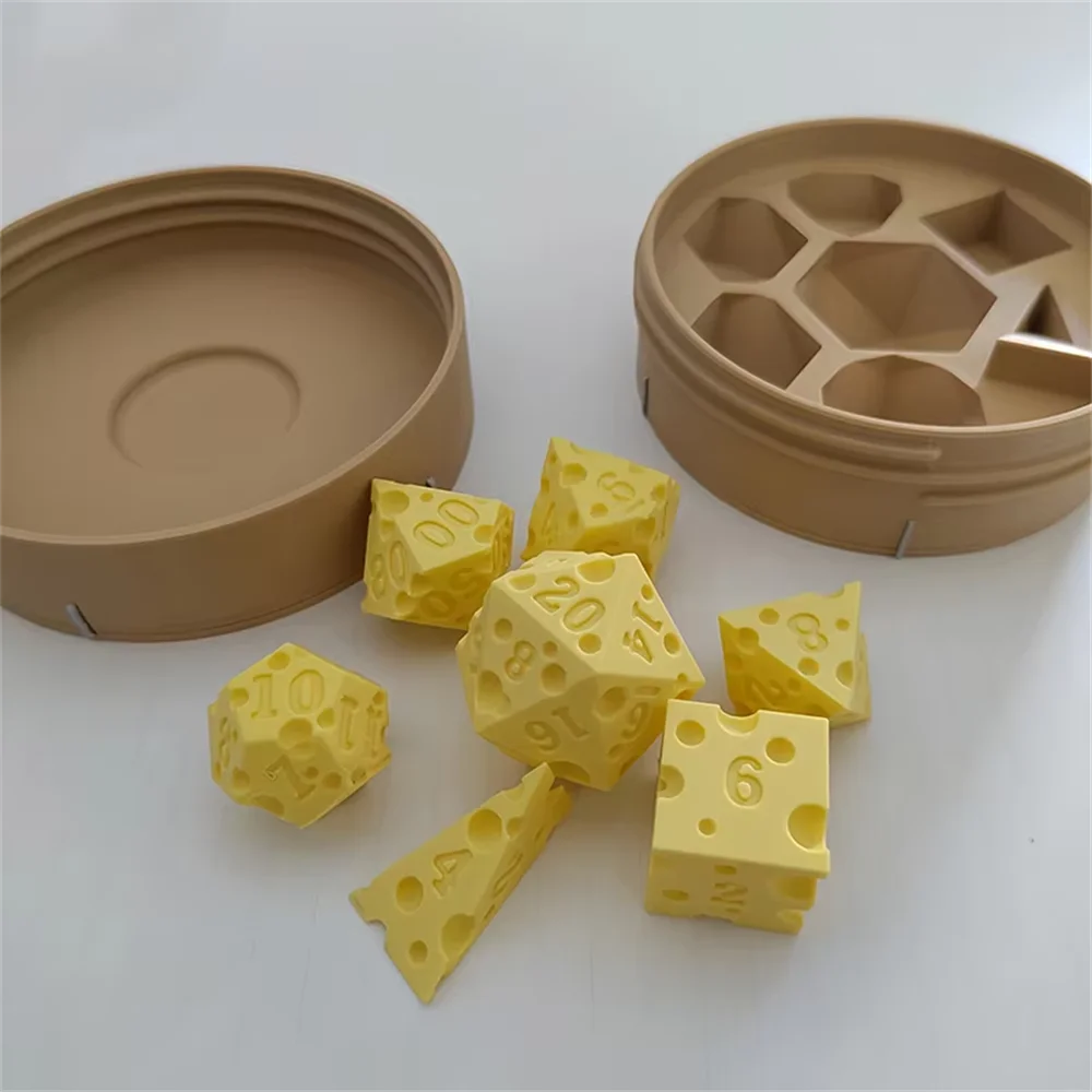 A set of yellow cheese dice cubes and a matching tan carrying case for game night.