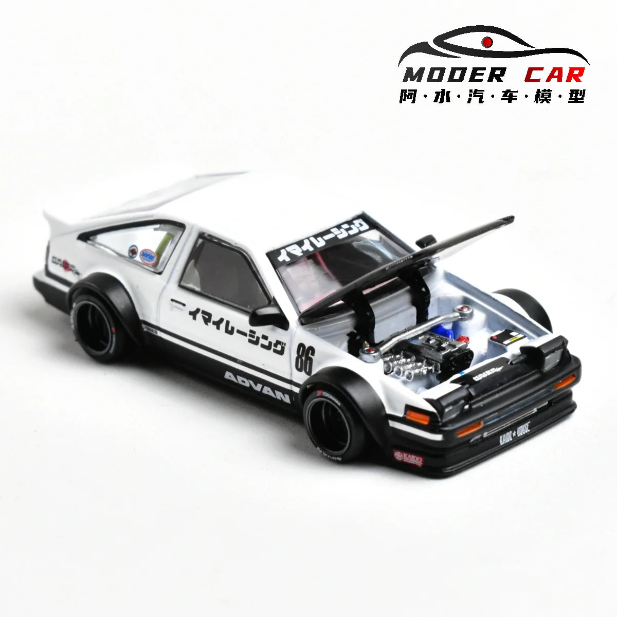 A detailed 1:64 scale diecast model of a white AE86 sports car with a black hood and racing livery.