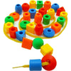 A colorful set of rainbow lacing beads and three strings used for a Montessori threading toy.