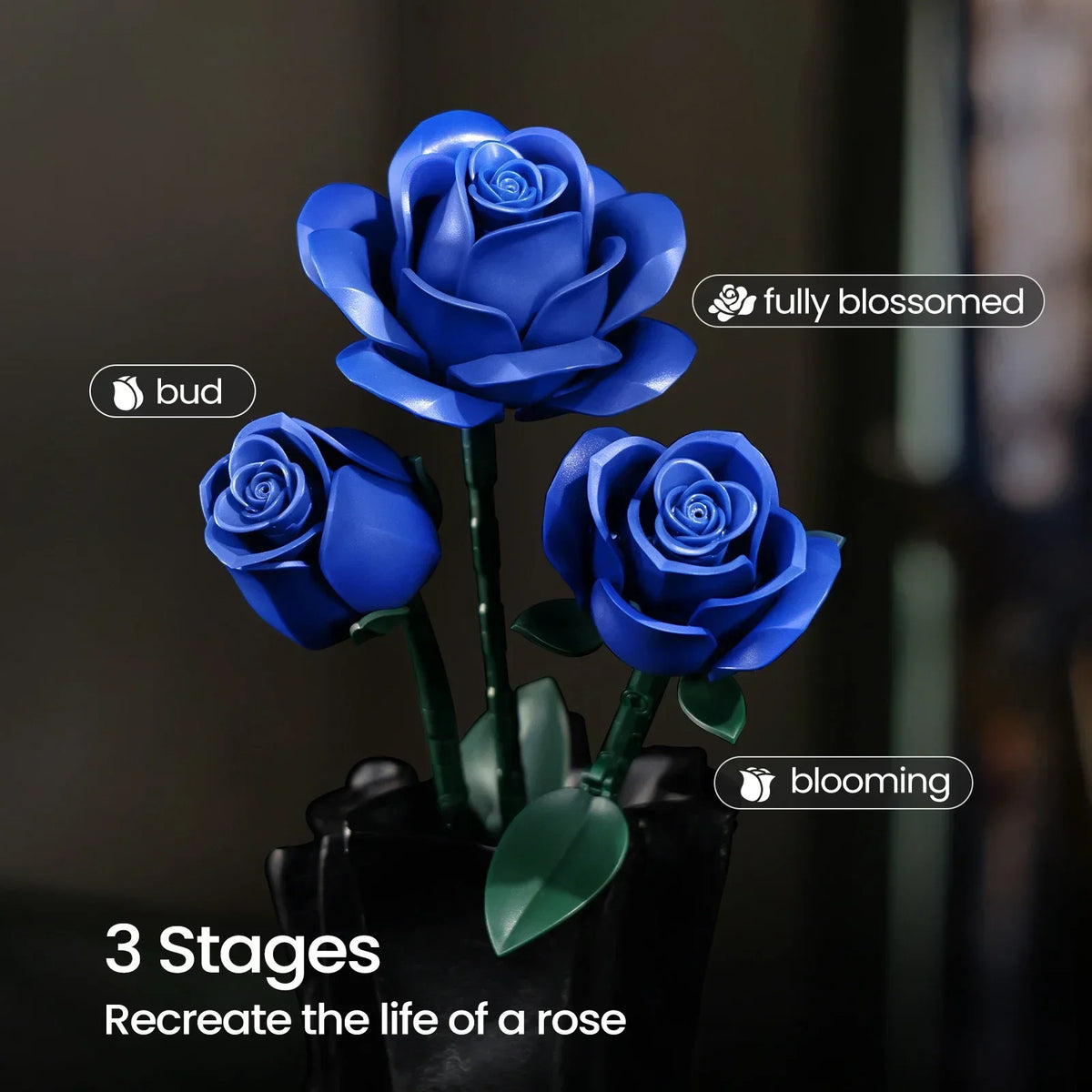 A set of three blue rose building blocks showing the stages of a rose's life: bud, blooming, and fully blossomed.