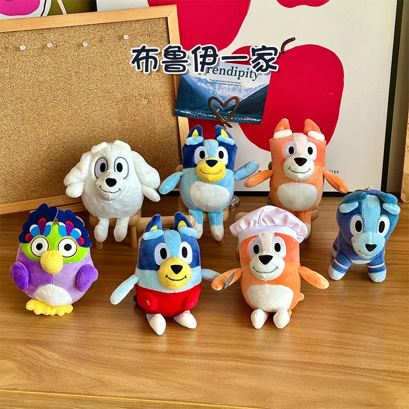 A collection of colorful Bluey plush dolls featuring various characters like Bingo and Bluey.