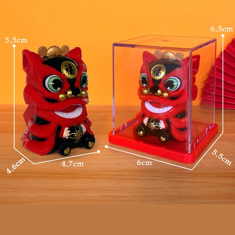 A red lion figurine with a shaking head design displayed inside a clear box.