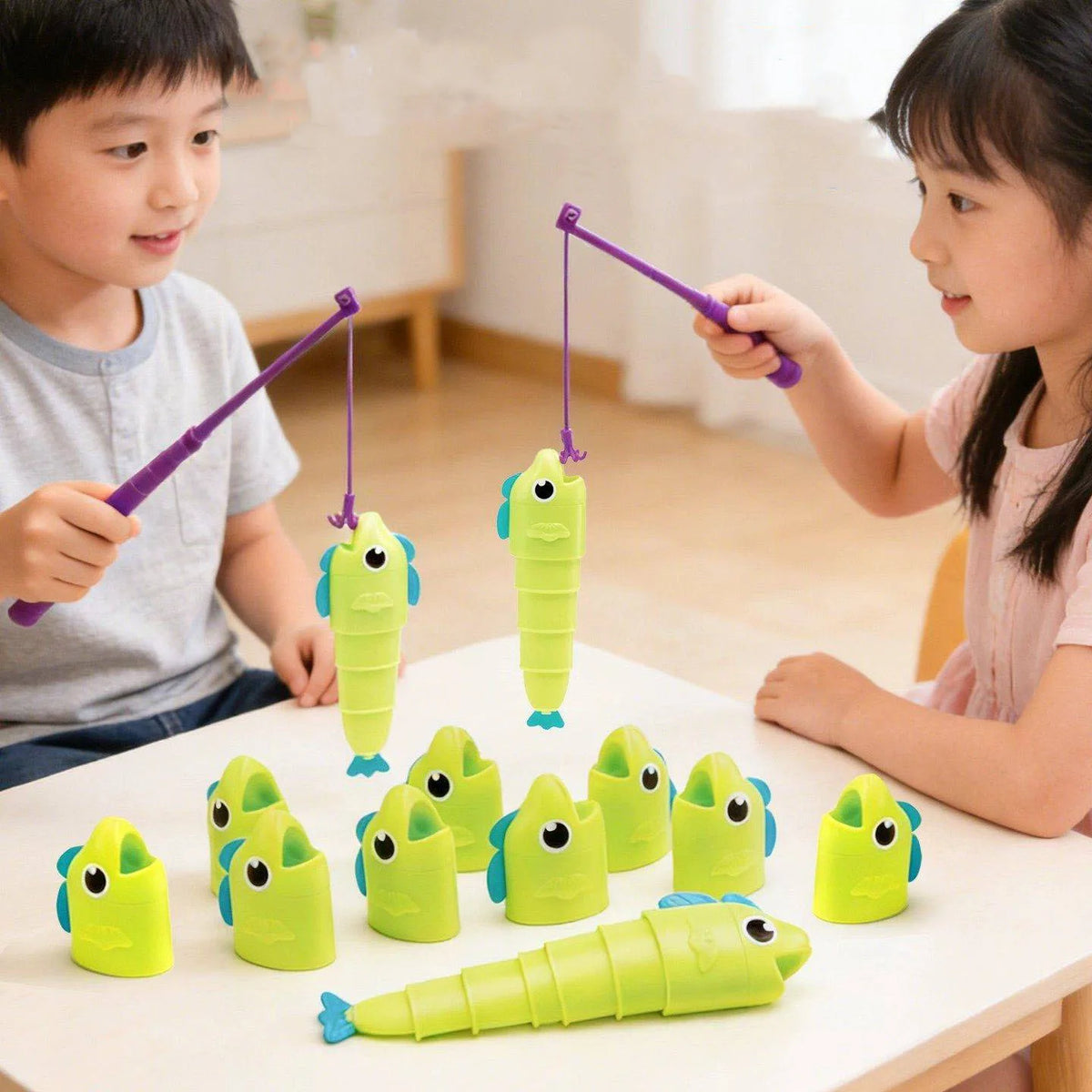 Two children play with a colorful stretchable fishing board game featuring yellow and green fish on a white table.