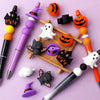 A collection of Halloween silicone beads featuring 3D bat and pumpkin shapes used for jewelry making.