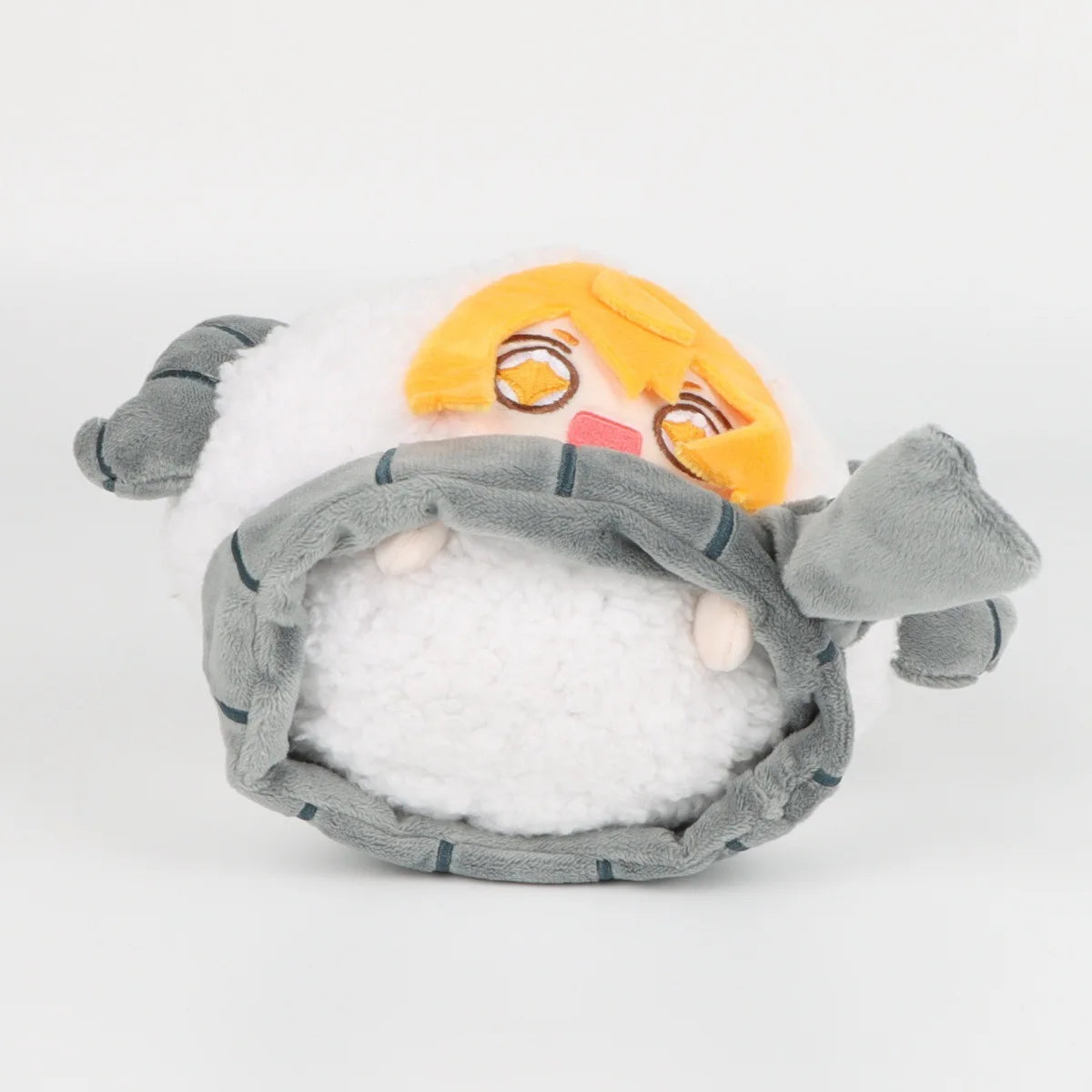 A soft plush doll of Don Quixote sheep with orange hair and gray features.