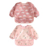 A pink 2-pack of waterproof full sleeve baby bibs featuring a rainbow pattern for feeding.